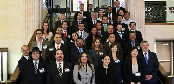 A group of Latin American lawyers in the main hall of the California Western classroom building